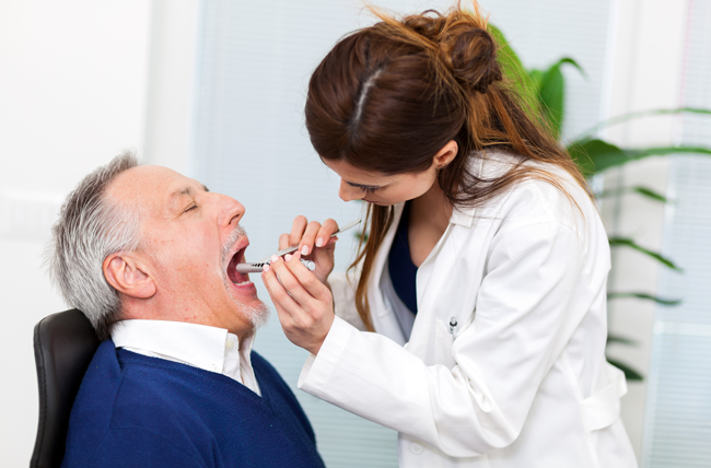 patient with mouth exam physician